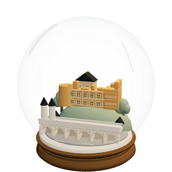 A snow globe with Heidelberg’s castle ruin on a hillside above the Old Bridge and the Neckar.